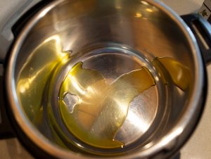 Heat olive oil in Instant Pot until just beginning to smoke